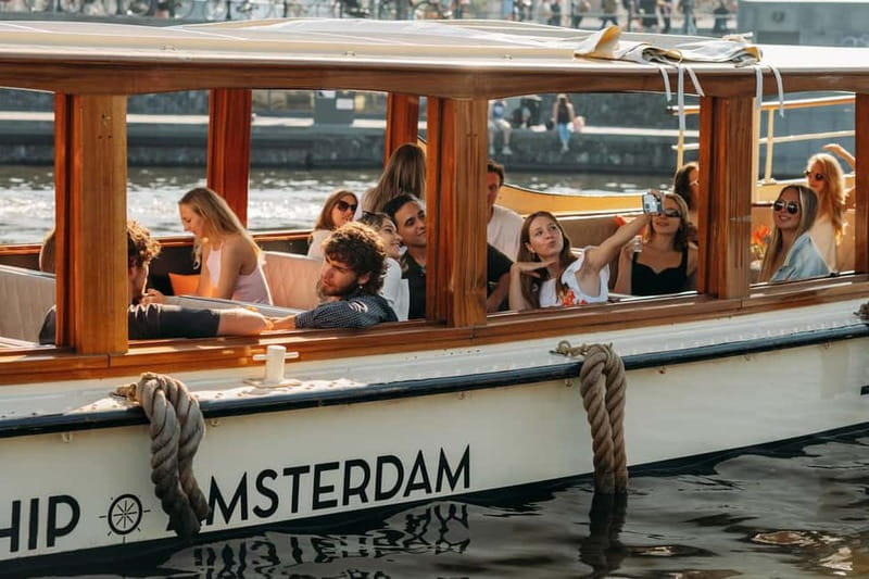 Amsterdam: Classic Saloon Boat Cruise with Cheese & Wine - The Golden Bend and the Amstel Hotel
