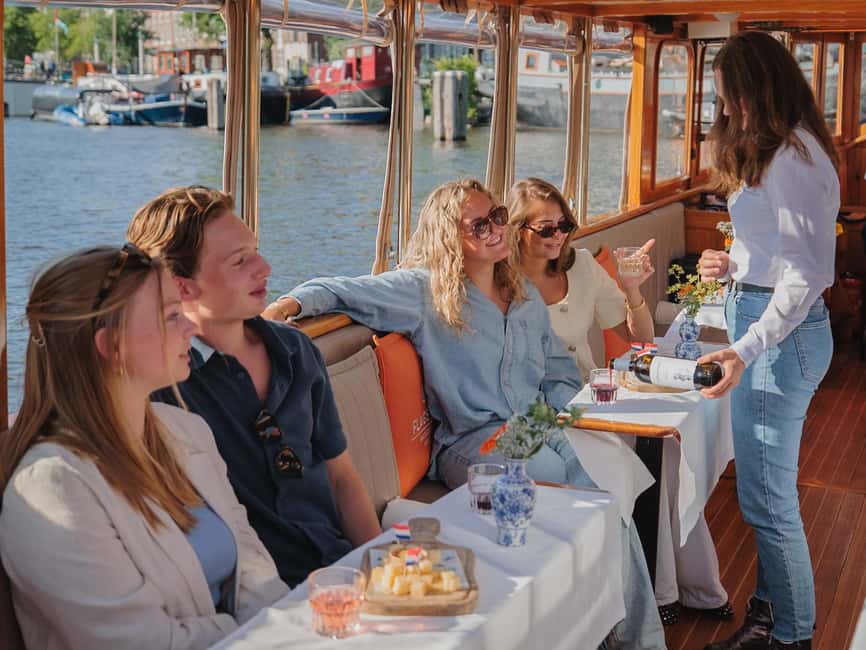 Amsterdam: Classic Saloon Boat Cruise with Cheese & Wine - Boarding at four possible Amsterdam locations