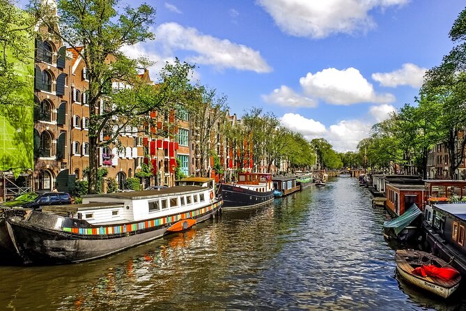 Amsterdam Day Trip from Brussels With Cheese, Clogs and Windmills - Arriving in Amsterdam: Dam Square and free time