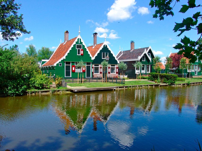 Amsterdam: Guided Zaanse Schans, Windmills & Cheese Tour - Watching a clog maker turn wood into tradition