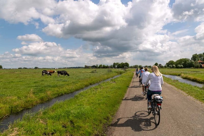 Amsterdam: Windmill, Cheese, and Countryside E-Bike Tour - Leaving Amsterdam by ferry