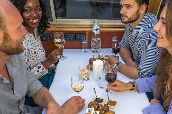 Amsterdam: Wine and Cheese Evening Cruise - Amsterdam’s illuminated canals from the water