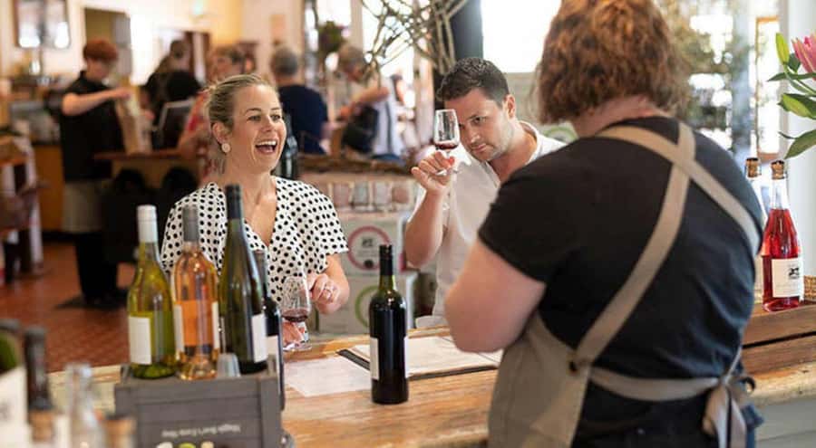 Barossa Valley: Maggie Beer's Wine Tasting & Cheese Platter - A full glass and cheese platter by the dam