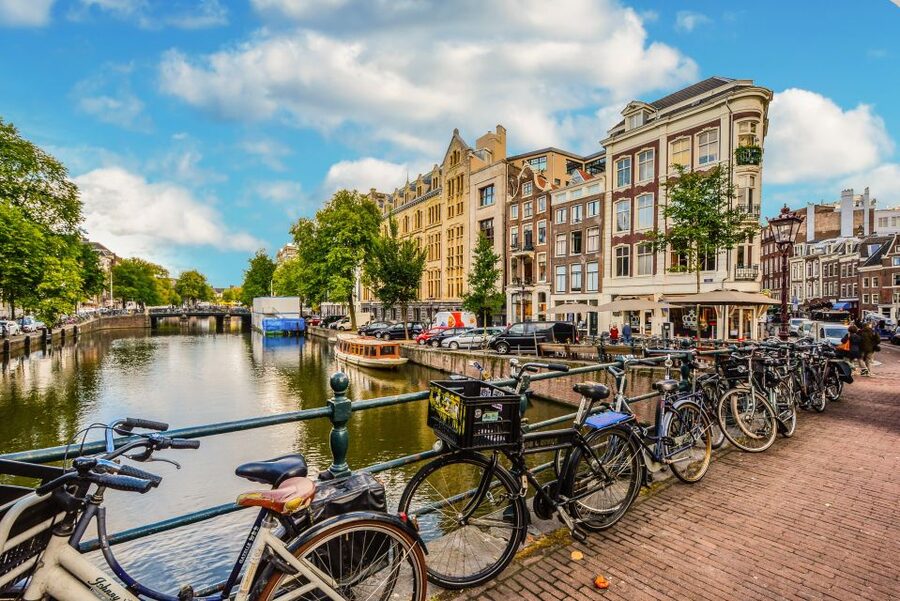 From Brussels: Cheese, Clogs & Windmills Amsterdam Day Trip - Amsterdam from the coach and the city center
