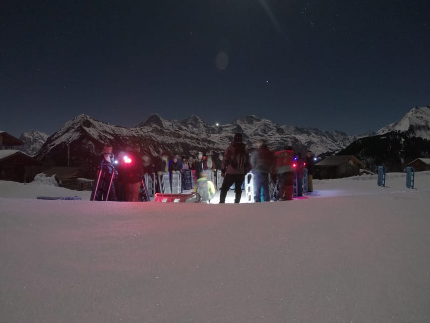 From Interlaken: Night Sledding with Cheese Fondue Dinner - Forests, meadows, and frozen waterfalls