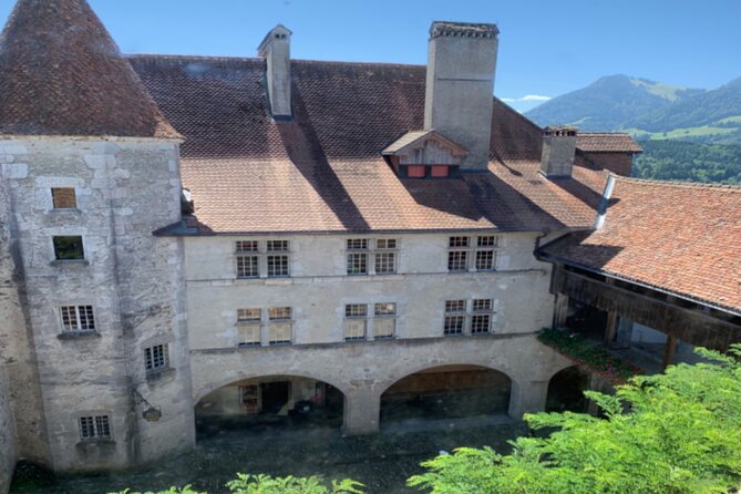 Gruyères Castle, Cheese, and Chocolate Tour | From Zurich - Seeing Gruyères cheese made the old-fashioned way