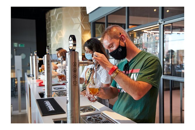 Guided Visit to the Estrella Galicia Museum with Cheese Pairing - Learning to pour beer in the tasting room
