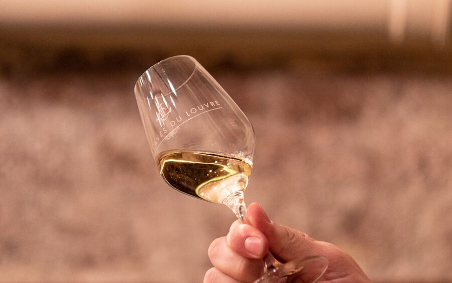 Paris: Apéro Wine and Cheese Tasting Experience - Entering Les Caves du Louvre at 52 Rue de l’Arbre Sec