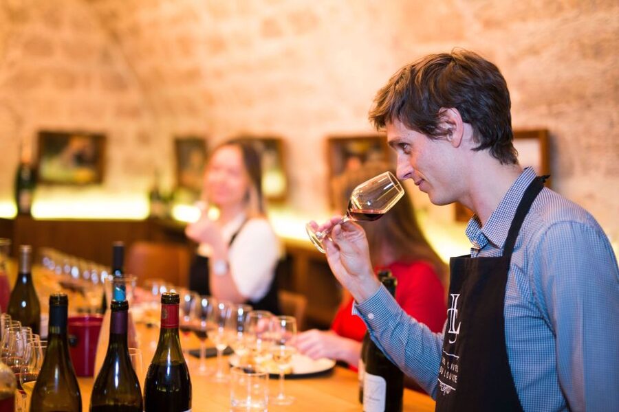 Paris: The Ultimate Wine and Cheese Tasting in English - The cellar setting at Les Caves du Louvre
