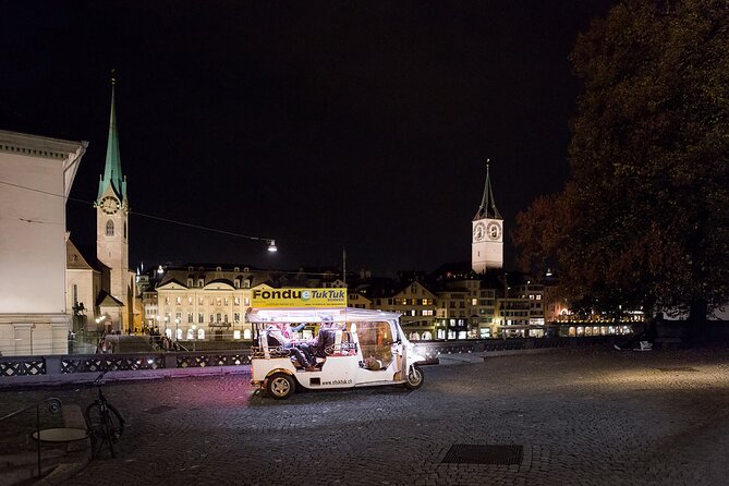 Zurich eTukTuk Private Tour - with Cheese Fondue and Wine - Fraumünster and Grossmünster across the river