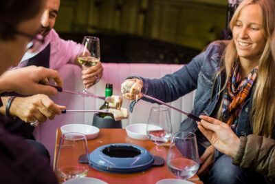 Zurich eTukTuk Private Tour – with Cheese Fondue and Wine